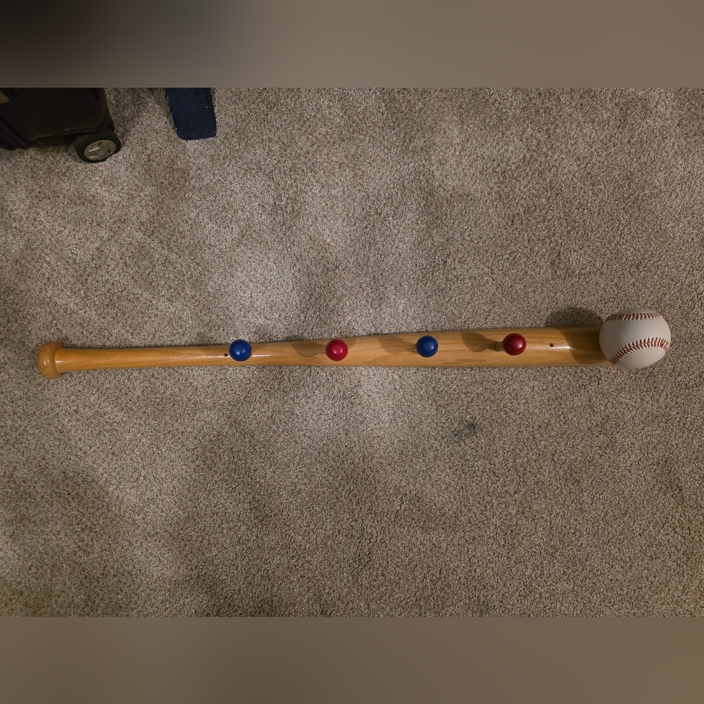 Wooden Balance Beam with Red and Blue Highlights